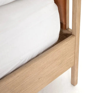 Detailed view of the bed’s frame corner, showing smooth curved edges and precise joinery.