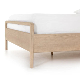 Detailed view of the bed’s frame corner, showing smooth curved edges and precise joinery.