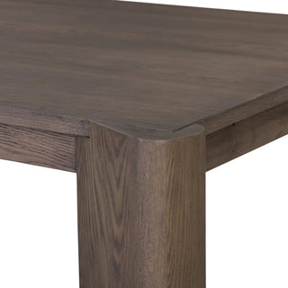 Detailed corner view of the Soho Dining Table, highlighting its angled oversized legs and solid construction.