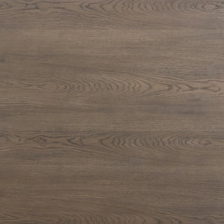 A close-up of the Soho Dining Table’s aged natural oak tabletop, showcasing natural cracks and wood texture.