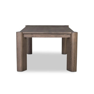 A side view of the Soho Dining Table, emphasizing its thick legs and minimalist structure.