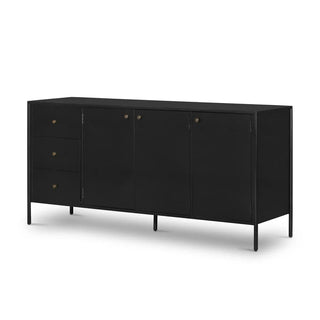 Angled view of a black bronzed iron sideboard featuring three drawers and three doors with brass handles.