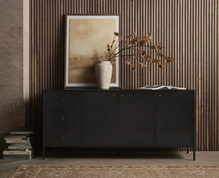 Stylish black bronzed iron sideboard placed in a contemporary living space with decor and artwork.