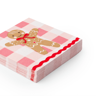 Stack of pink checkered napkins with a gingerbread man design on a white background