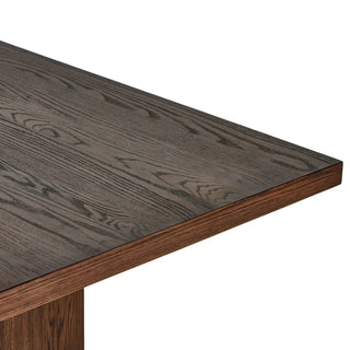 A detailed shot of the Torrington Dining Table’s smooth tabletop edges, highlighting the refined wood finish.