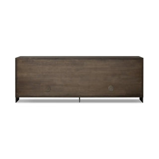 Back panel of a modern black oak sideboard, displaying the smooth wood finish and cable management cutouts.