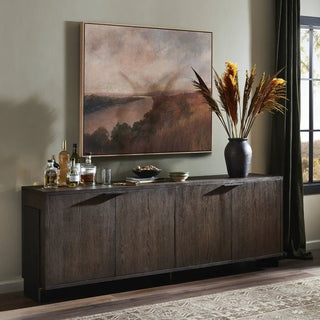 Modern black oak sideboard styled in a contemporary living space with decor and artwork.